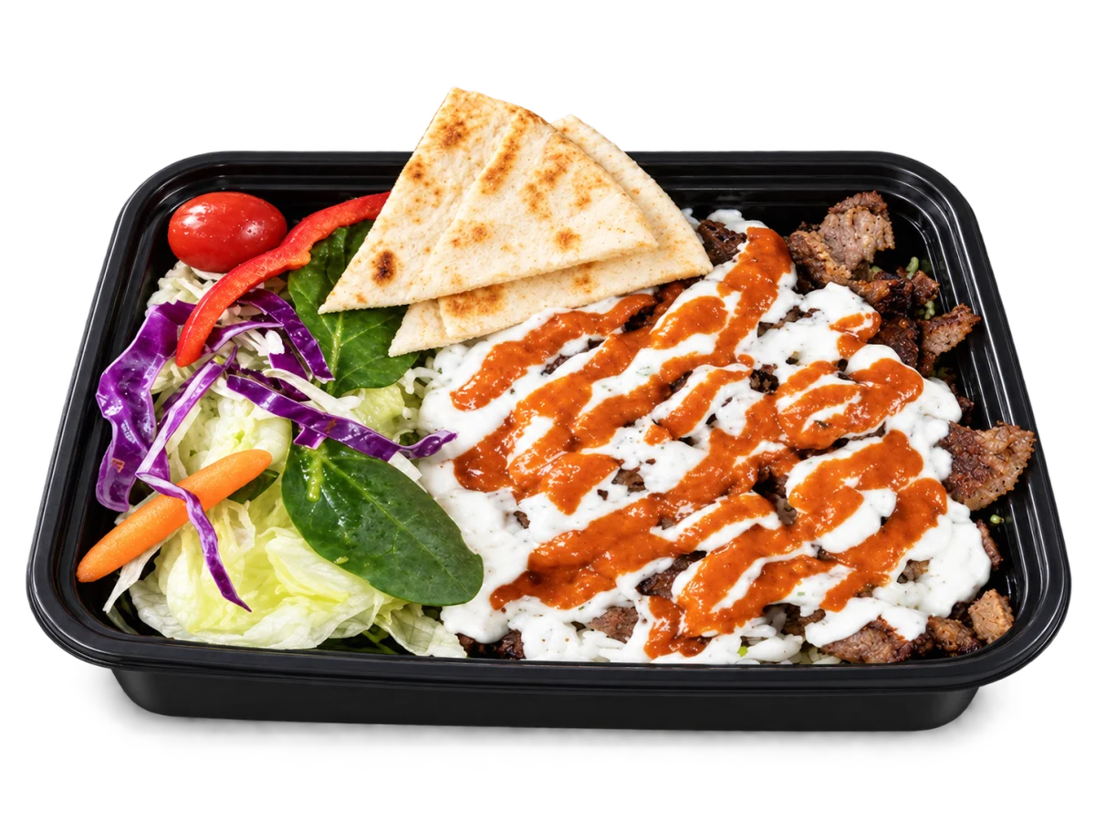 Browned gyro lamb with white and red sauces, rice, salad and pita in a whole Box’d Kitchen takeaway tray